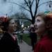 From right: Porscha Kazmierczak and Mary Blake-Booth, of Ann Arbor, wait outside the University of Michigan Museum of Art before parading through the streets of downtown Ann Arbor as part of Festifool weekend's FoolMoon event on Friday, March 30. Chris Asadian | AnnArbor.com